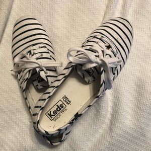 Navy and white striped Ked’s tennis shoes